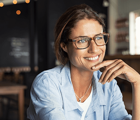 Happy woman with glasses enjoying good vision