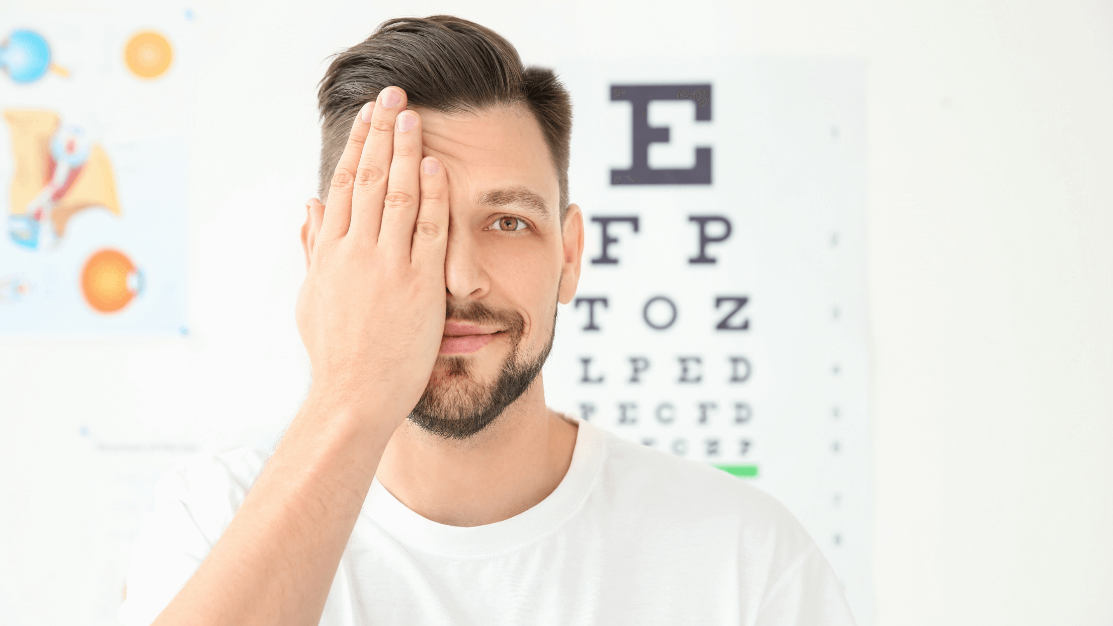 Man undergoing a vision test during an eye exam to determine LASIK candidacy with an eye doctor.