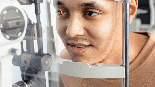 Optometrist performing a cataract evaluation with advanced eye imaging